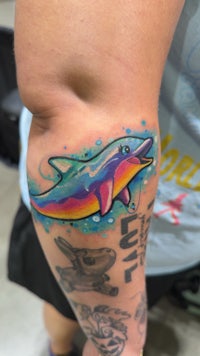 a tattoo of an astronaut on a thigh