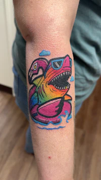a tattoo of a man in a hat and a hat